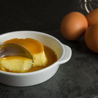 Leche Flan Recipe Traditional Filipino Dessert, milk pudding on dark background.